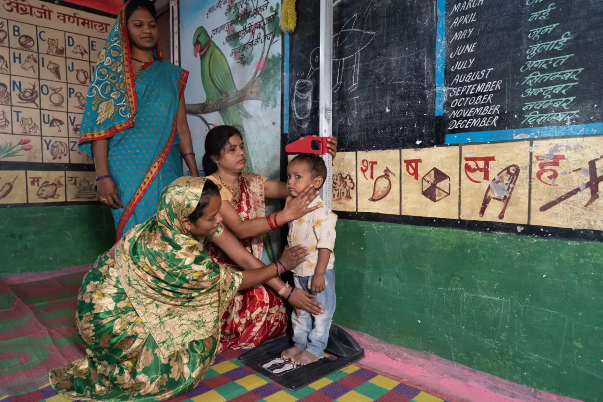 Woman measuring child
